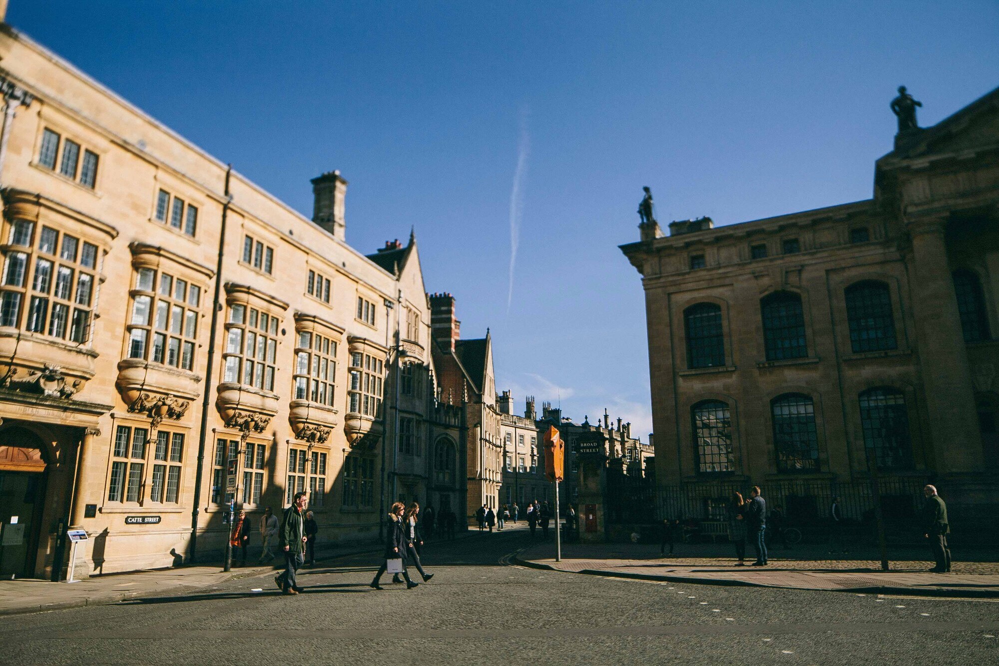 Tourists strolling through the city of Oxford in late Summer